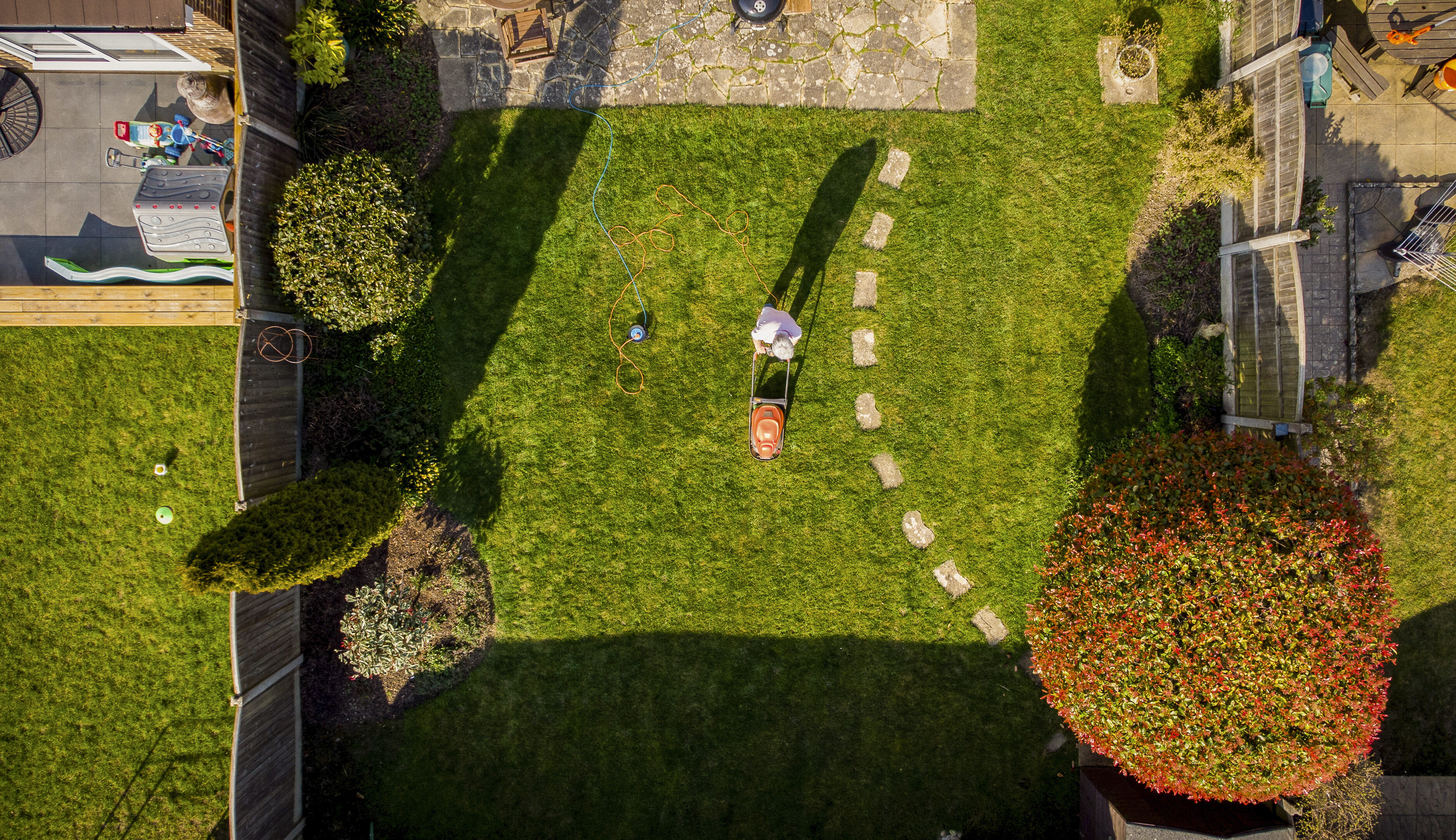 Aerial view of person mowing lawn